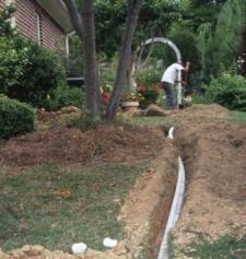 an irrigation line being laid in a residential back yard
